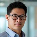 Portrait of Dr. David Chen, a man with a thoughtful expression and a background suggesting a science lab.