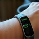 Close-up of a WHOOP strap on a wrist, showing its connection to a mobile app interface.