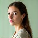 Portrait of Sarah Miller, a holistic wellness coach specializing in sleep and balance, looking contemplative.